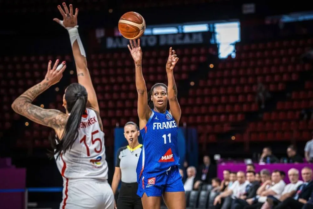 Valériane Ayayi of France shoots over Tilbe Şenyürek of Turkey during a group stage game at Peace and Friendship Stadium.